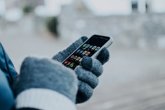 person using gardening app on smartphone