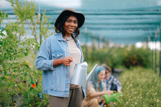 image of a gardener watering plants